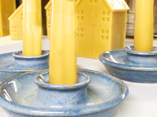beeswax candles in ceramic candle holders