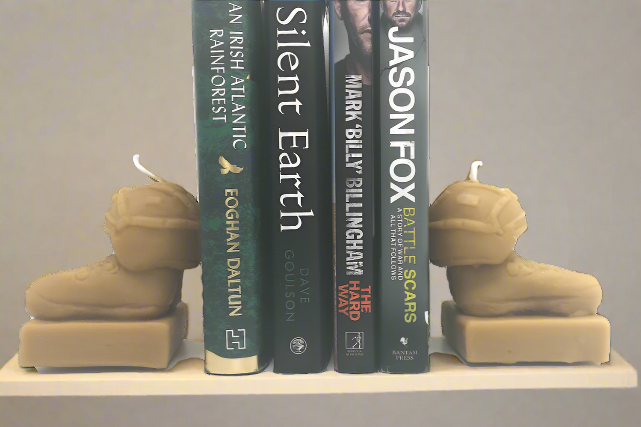 two Veterans’ candles as bookends with 4 books in-between them