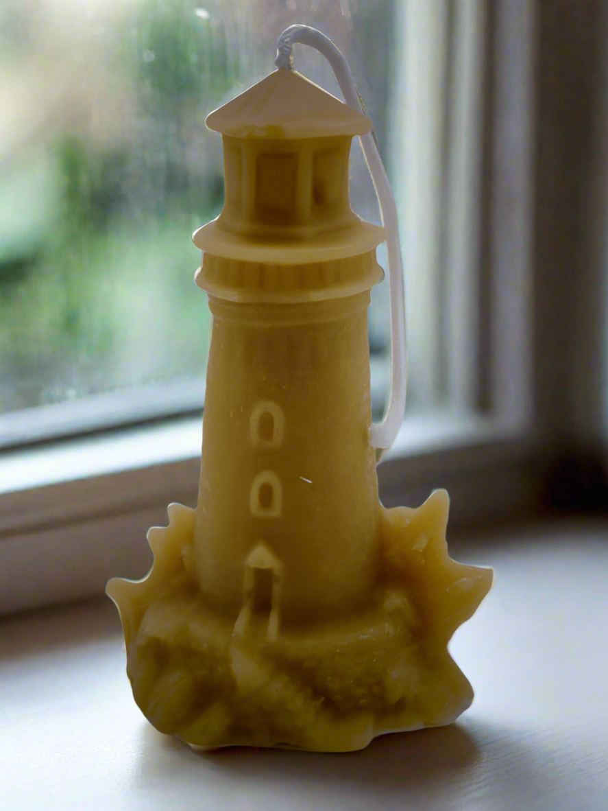 lighthouse ornamental candle in window