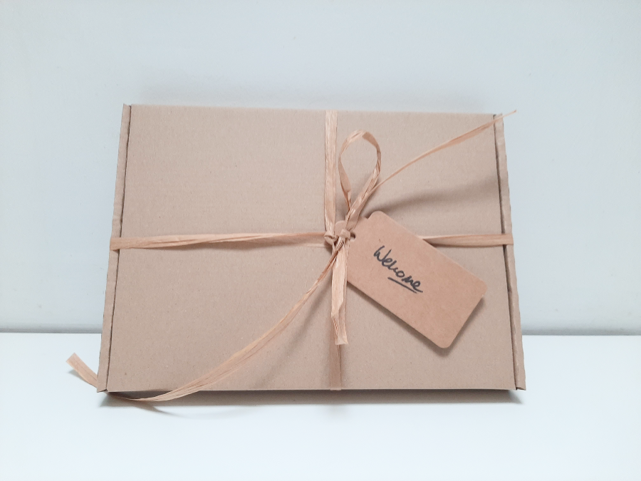 Membership pack with ribbon and tag saying welcome