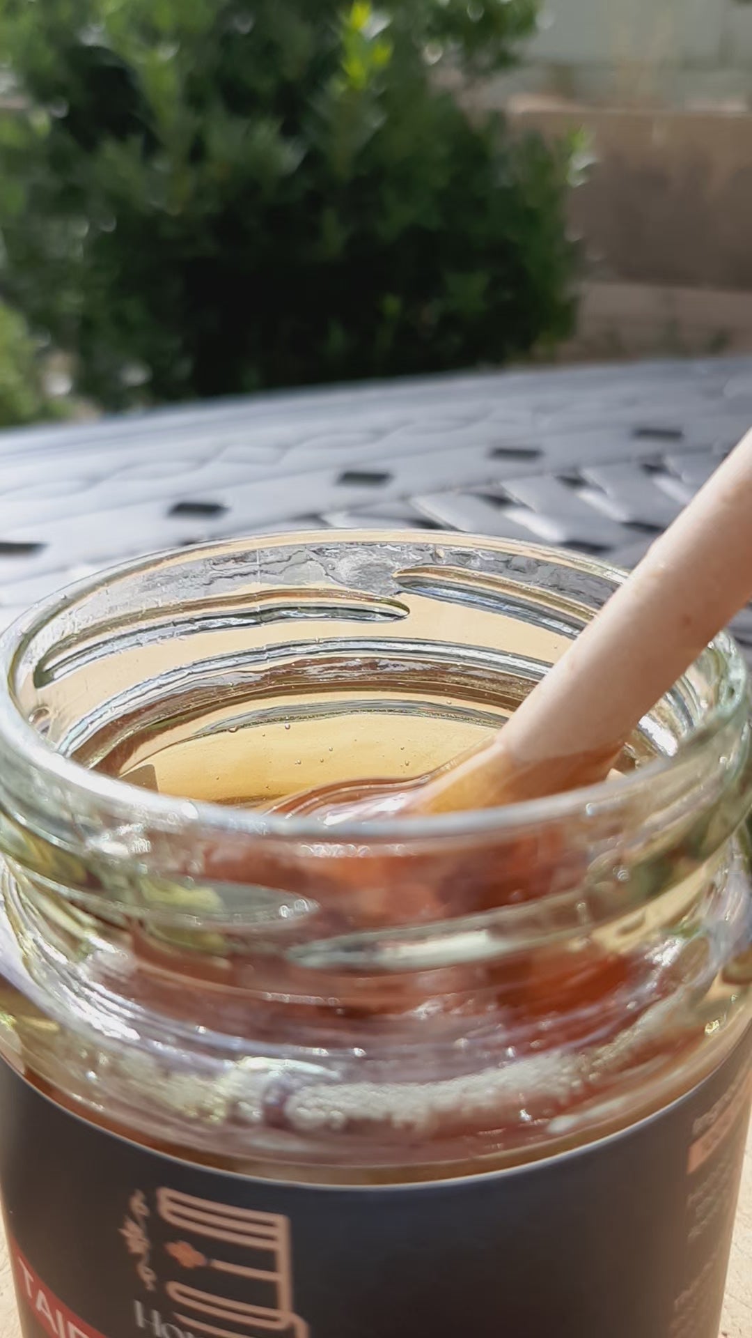 Load video: Taif rose honey drizzling in sunlight
